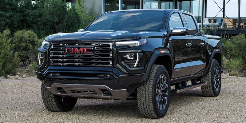 2026 GMC Canyon Denali parked outdoors highlighting advanced safety features and bold exterior styling