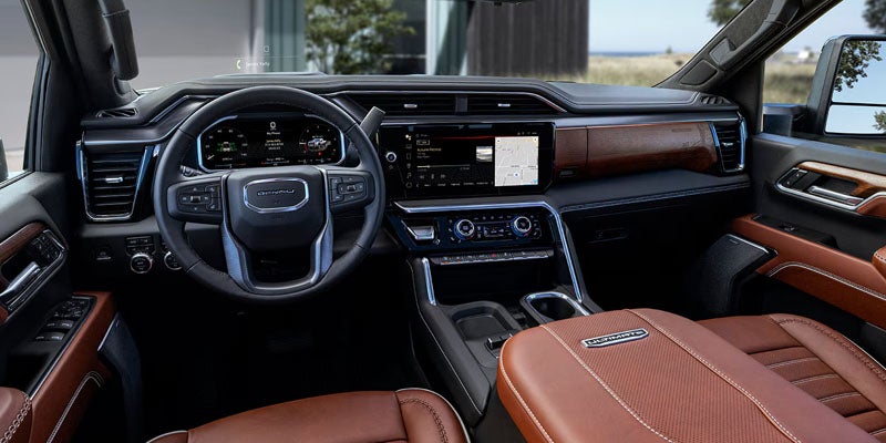 Premium interior of the 2026 GMC Sierra 2500 HD featuring leather seating and advanced cockpit controls.